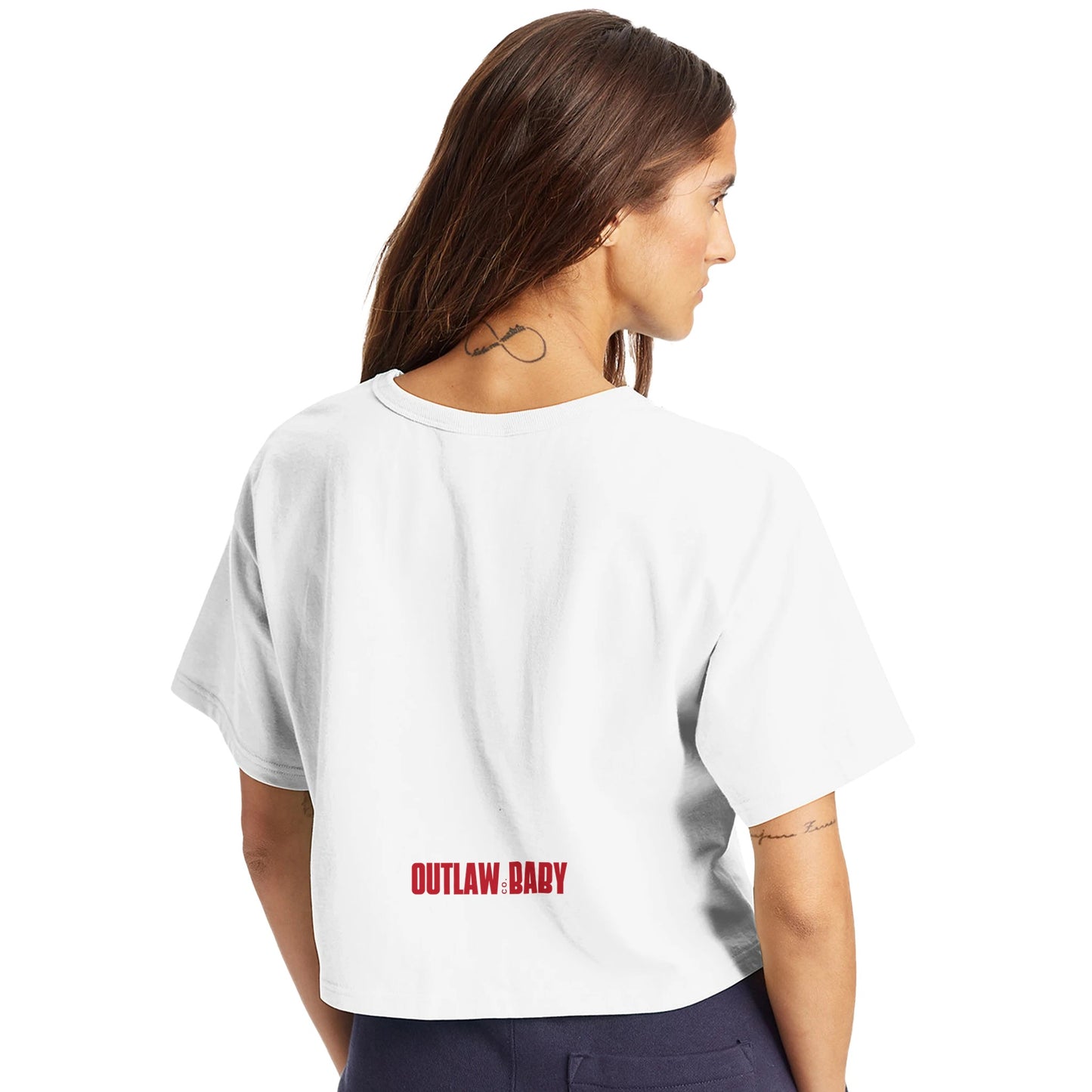 Back of this white cropped tee has red "Outlaw Baby Co." Logo centered approx 8" above the shirt hem